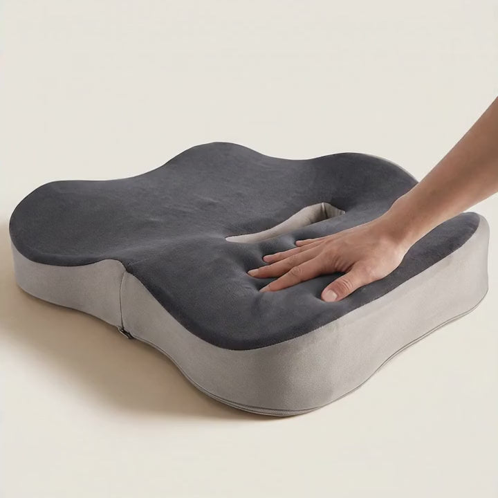 Hand presses the Ovva memory foam seat cushion and it slowly comes back to shape